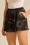 SHORT VISCOSE ESTAMPADA COM BOLSO E CORDINHA DE VIÉS COM PONTEIRA