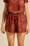 SHORT VISCOSE ESTAMPADA COM BOLSO E CORDINHA DE VIÉS COM PONTEIRA