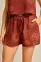 SHORT VISCOSE ESTAMPADA COM BOLSO E CORDINHA DE VIÉS COM PONTEIRA